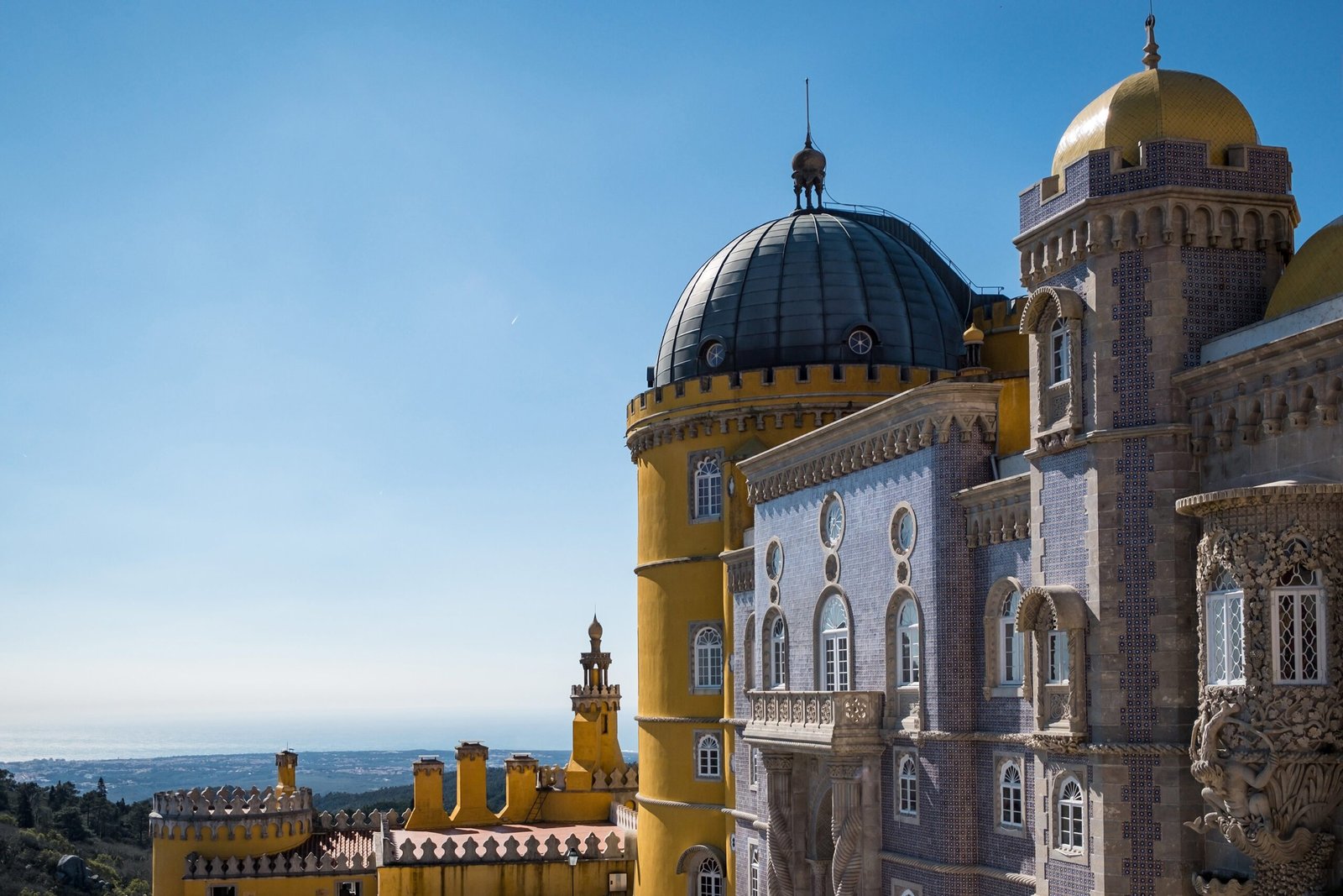 castle sintra cascais surrounded by greenery sunlight blue sky portugal scaled